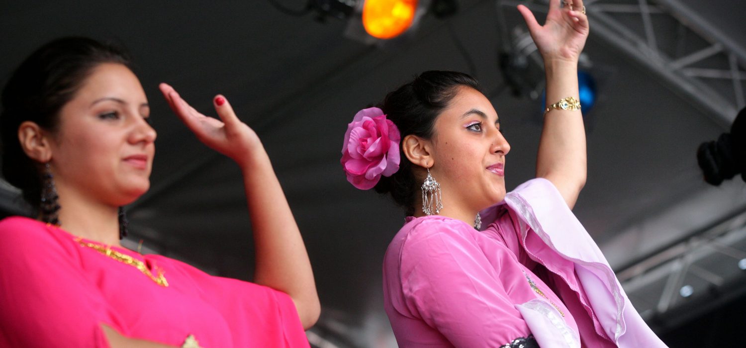 A photo of women dancing at Refugee Week Wales.